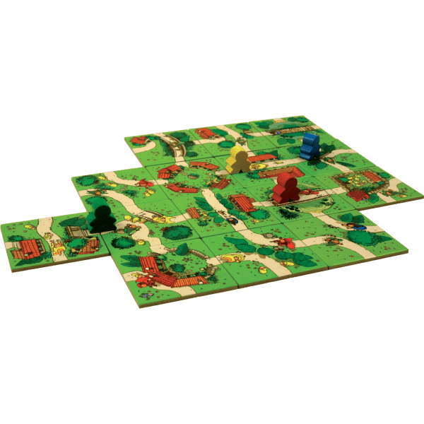 Carcassonne Junior játékelemek pályával, figurákkal és kártyákkal felülről fotózva